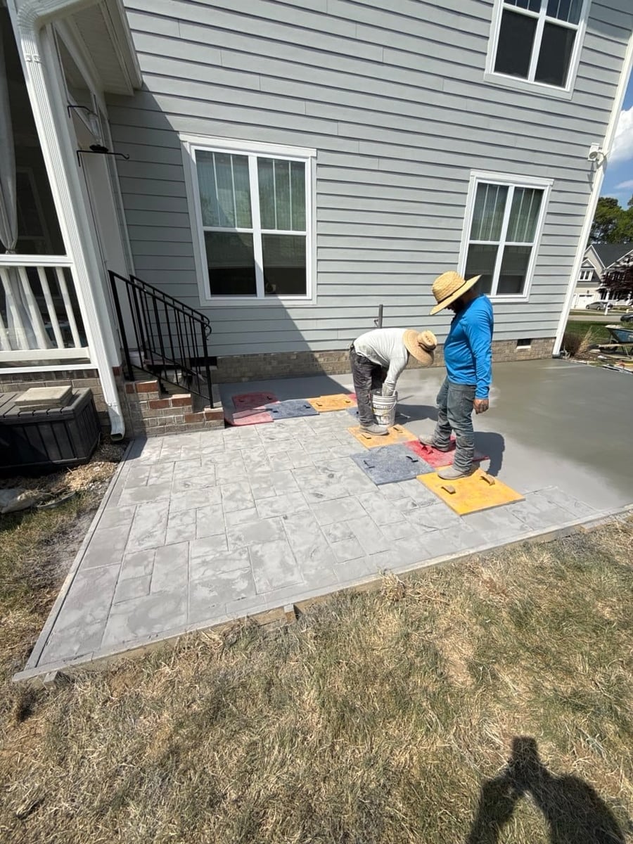 Gulf Stream Contracting crew stamping a fresh concrete patio — Hampton Roads, VA