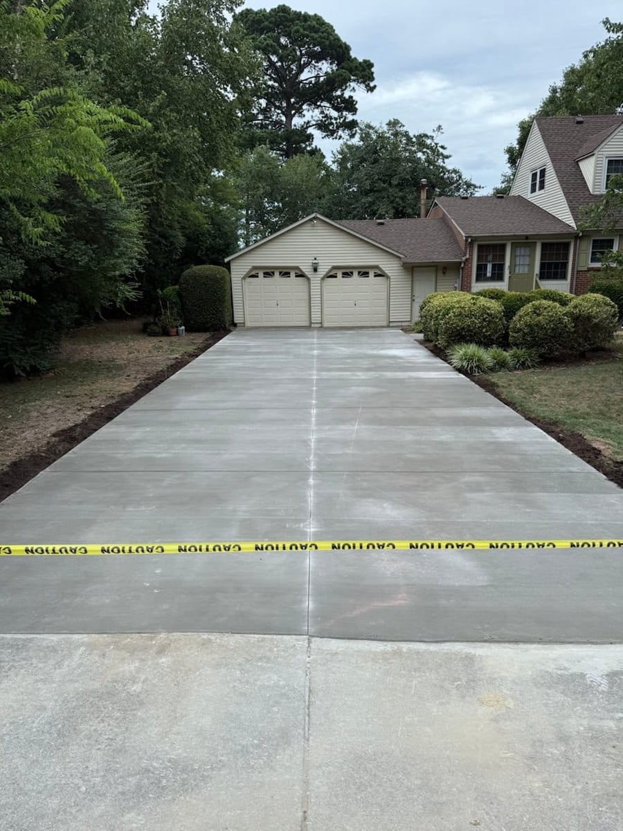 Long two-car driveway curing with caution tape — Hampton Roads, VA